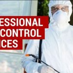 pest control expert wearing protective white overalls