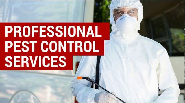 pest control expert wearing protective white overalls