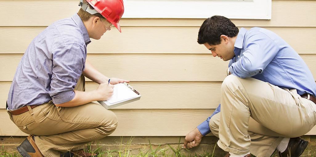 pest control technician inspecting a property